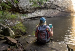 Hiker_30ozTiffanyBlue_Tumbler_1728x hiker holding blue tumbler at water